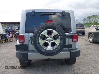 2016 Jeep Wrangler Unlimited Sahara with VIN 1C4BJWEG3GL240859, listed as a IAAI auction lot 42628937 with 103,378 mi miles and . Bid and sale history available at DreamBid. Image 16.