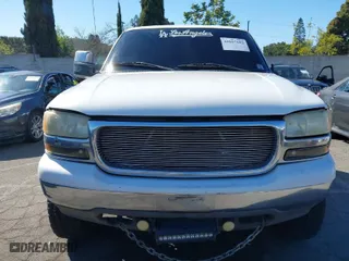 2000 GMC Sierra 1500 SLT with VIN 1GTEC19T7YZ241853, listed as a IAAI auction lot 41657692 with 166,517 mi miles. Bid and sale history available at carsss.com. Image 12.