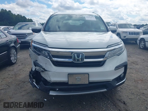 2020 Honda Pilot Elite with VIN 5FNYF6H08LB014288, listed as a IAAI auction lot 40496871 with 57,921 mi miles and . Bid and sale history available at DreamBid. Image 12.