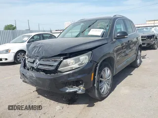 2012 Volkswagen Tiguan SE with VIN WVGAV7AX6CW521960, listed as a IAAI auction lot 42249355 with 118,496 mi miles and . Bid and sale history available at DreamBid. Image 2.