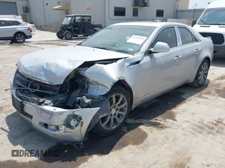 2009 Cadillac CTS RWD z VIN 1G6DV57V990149721, wystawiony jako IAAI lot #42293590 z przebiegiem 64 642 mil mil oraz . Historia ofert i sprzedaży dostępna na DreamBid. Obrazek 2.