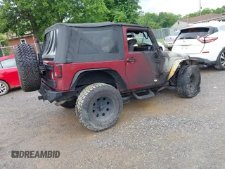 2012 Jeep Wrangler Sport with VIN 1C4AJWAG9CL203018, listed as a IAAI auction lot 42377899 with Not provided miles and . Bid and sale history available at DreamBid. Image 4.