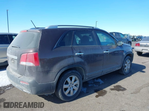 2013 Kia Sorento LX with VIN 5XYKT3A60DG379067, listed as a IAAI auction lot 41613664 with 142,651 mi miles and . Bid and sale history available at carsss.com. Image 4.