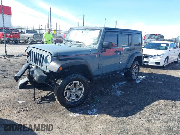 2015 Jeep Wrangler Unlimited Willys Wheeler with VIN 1C4BJWDG4FL589822, listed as a IAAI auction lot 41732614 with 149,112 mi miles and . Bid and sale history available at DreamBid. Image 20.