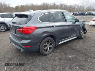 2017 BMW X1 xDrive28i with VIN WBXHT3Z39H4A57753, listed as a IAAI auction lot 41726790 with 52,509 mi miles. Bid and sale history available at carsss.com. Image 4.