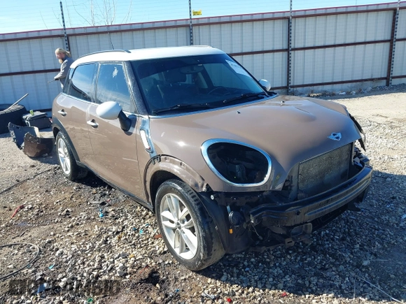 2014 MINI Countryman S with VIN WMWZC3C5XEWP52054, listed as a IAAI auction lot 41452354 with 104,873 mi miles and . Bid and sale history available at DreamBid. Image 1.