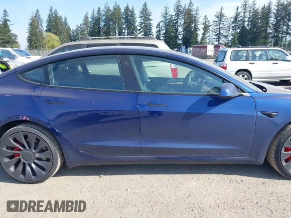 2023 Tesla Model 3 Performance with VIN 5YJ3E1EC2PF679613, listed as a IAAI auction lot 42099199 with 21,721 mi miles. Bid and sale history available at carsss.com. Image 14.