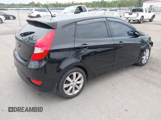 2013 Hyundai Accent SE with VIN KMHCU5AE8DU109616, listed as a IAAI auction lot 42051364 with 96,739 mi miles. Bid and sale history available at carsss.com. Image 4.