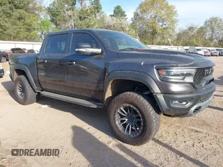 2022 Ram 1500 TRX with VIN 1C6SRFU94NN150172, listed as a IAAI auction lot 41858614 with 52,633 mi miles and . Bid and sale history available at DreamBid. Image 1.