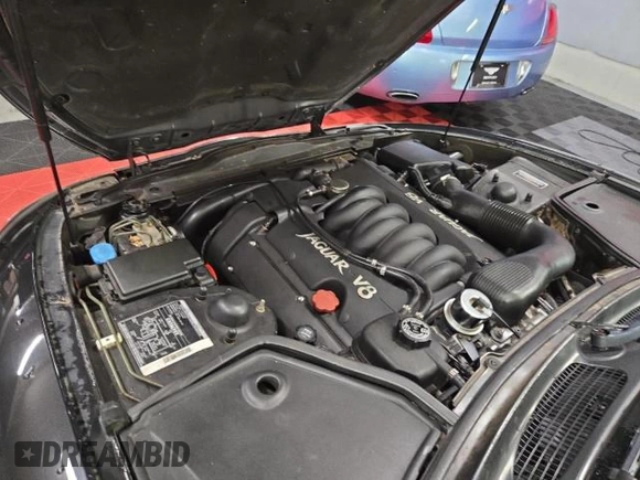 1997 Jaguar XK with VIN SAJGX5748VC006720, listed as a Copart auction lot 80928284 with 96,279 mi miles and Clean Title. Bid and sale history available at DreamBid. Image 7.