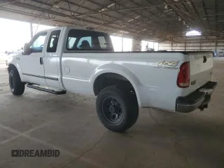 2000 Ford Super Duty F-250 XL with VIN 1FTNX21S9YED03242, listed as a Copart auction lot 74542704 with 218,739 mi miles and Salvage Title. Bid and sale history available at carsss.com. Image 2.