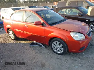 2010 Kia Rio LX with VIN KNADH4A3XA6665381, listed as a IAAI auction lot 41516189 with 111,081 mi miles. Bid and sale history available at carsss.com. Image 1.