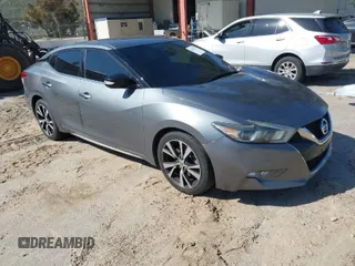 2018 Nissan Maxima Platinum z VIN 1N4AA6AP4JC373550, wystawiony jako IAAI lot #41827941 z przebiegiem 80 746 mil mil oraz . Historia ofert i sprzedaży dostępna na DreamBid. Obrazek 1.