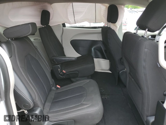 2023 Chrysler Voyager LX z VIN 2C4RC1CG0PR601874, wystawiony jako Copart lot #56747115 z przebiegiem 51 210 mil mil oraz Nie do naprawy. Historia ofert i sprzedaży dostępna na DreamBid. Obrazek 11.