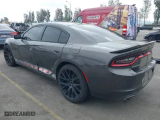 2019 Dodge Charger SXT with VIN 2C3CDXBG2KH643442, listed as a IAAI auction lot 41896681 with 104,061 mi miles. Bid and sale history available at carsss.com. Image 3.