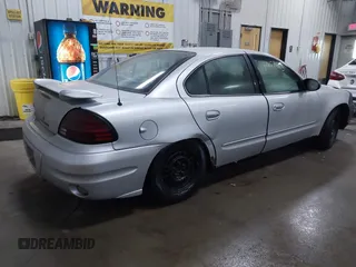 2005 Pontiac Grand Am SE with VIN 1G2NE52E25M168028, listed as a IAAI auction lot 41457663 with 174,933 mi miles. Bid and sale history available at carsss.com. Image 4.