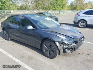 2023 Tesla Model 3 with VIN 5YJ3E1EA6PF701109, listed as a IAAI auction lot 40491628 with 9,989 mi miles. Bid and sale history available at carsss.com. Image 1.