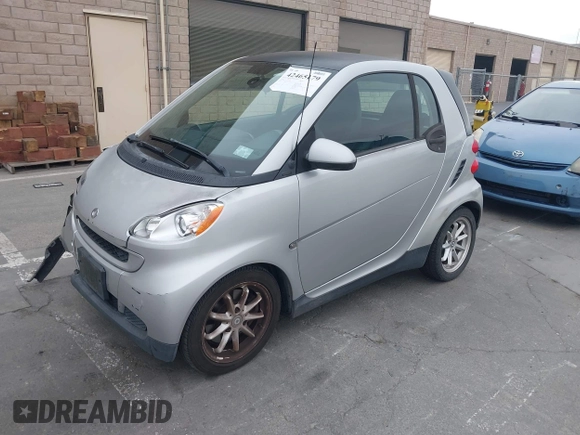 2009 Smart fortwo Pure z VIN WMEEJ31X99K209322, wystawiony jako IAAI lot #42465179 z przebiegiem 75 730 mil mil oraz . Historia ofert i sprzedaży dostępna na DreamBid. Obrazek 17.