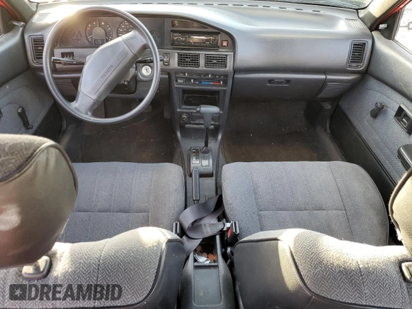 1990 Toyota Corolla z VIN 1NXAE94A6LZ127972, wystawiony jako Copart lot #80673204 z przebiegiem 186 993 mil mil oraz Szkoda całkowita • Salvage title. Historia ofert i sprzedaży dostępna na DreamBid. Obrazek 8.