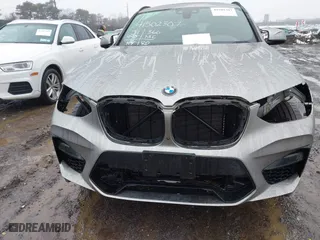 2021 BMW X4 M with VIN 5YMUJ0C01M9F26207, listed as a IAAI auction lot 41502307 with 31,995 mi miles. Bid and sale history available at carsss.com. Image 6.