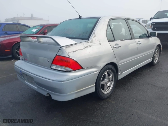 2002 Mitsubishi Lancer OZ-Rally with VIN JA3AJ86E92U038601, listed as a IAAI auction lot 41025991 with 162,450 mi miles. Bid and sale history available at carsss.com. Image 4.