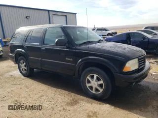 2000 Oldsmobile Bravada z VIN 1GHDT13W3Y2178106, wystawiony jako Copart lot #85069954 z przebiegiem 211 164 mil mil oraz Szkody całkowita. Historia ofert i sprzedaży dostępna na DreamBid. Obrazek 4.