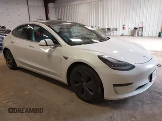 2020 Tesla Model 3 Standard Range Plus with VIN 5YJ3E1EA4LF802207, listed as a IAAI auction lot 41843515 with 67,156 mi miles. Bid and sale history available at carsss.com. Image 1.