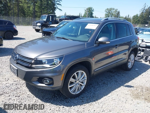 2013 Volkswagen Tiguan SEL with VIN WVGBV3AX1DW595673, listed as a IAAI auction lot 42140263 with 77,457 mi miles and . Bid and sale history available at DreamBid. Image 2.