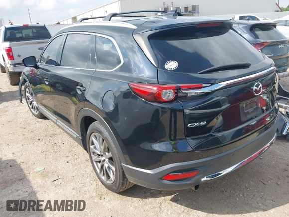 2017 Mazda CX-9 Grand Touring with VIN JM3TCADY5H0129798, listed as a IAAI auction lot 42079754 with 128,403 mi miles and . Bid and sale history available at DreamBid. Image 3.