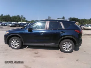 2014 Mazda CX-5 Touring z VIN JM3KE2CYXE0429149, wystawiony jako IAAI lot #42471772 z przebiegiem 222 440 mil mil oraz . Historia ofert i sprzedaży dostępna na DreamBid. Obrazek 14.