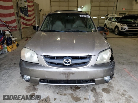 2001 Mazda Tribute LX with VIN 4F2CU08101KM05943, listed as a Copart auction lot 84077694 with 137,937 mi miles and Salvage Title. Bid and sale history available at DreamBid. Image 5.