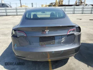 2023 Tesla Model 3 with VIN 5YJ3E1EA3PF695267, listed as a Copart auction lot 52559645 with 9,025 mi miles and Salvage title. Bid and sale history available at DreamBid. Image 6.