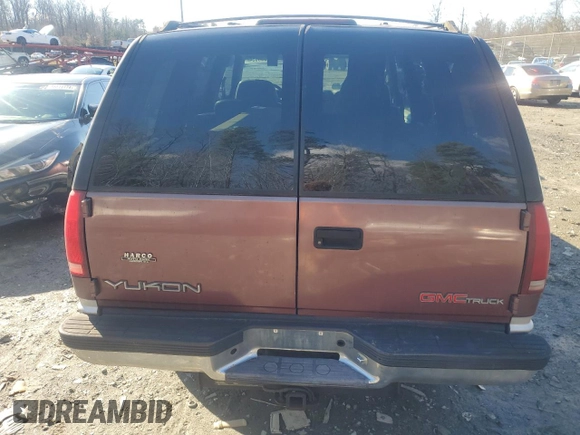 1997 GMC Yukon with VIN 1GKEK13R1VJ702558, listed as a Copart auction lot 85930054 with 165,837 mi miles and Salvage Title. Bid and sale history available at carsss.com. Image 6.