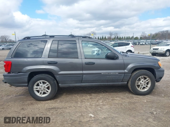 2004 Jeep Grand Cherokee Laredo z VIN 1J4GW48SX4C213322, wystawiony jako IAAI lot #41969362 z przebiegiem 273 876 mil mil oraz . Historia ofert i sprzedaży dostępna na DreamBid. Obrazek 13.