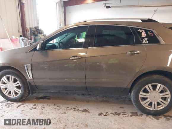 2015 Cadillac SRX Luxury Collection with VIN 3GYFNBE34FS575613, listed as a IAAI auction lot 41697251 with 173,117 mi miles and . Bid and sale history available at DreamBid. Image 14.