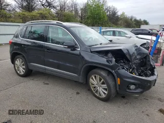2014 Volkswagen Tiguan S z VIN WVGBV3AX5EW554500, wystawiony jako Copart lot #57016775 z przebiegiem 91 101 mil mil oraz Szkoda całkowita • Salvage title. Historia ofert i sprzedaży dostępna na DreamBid. Obrazek 4.