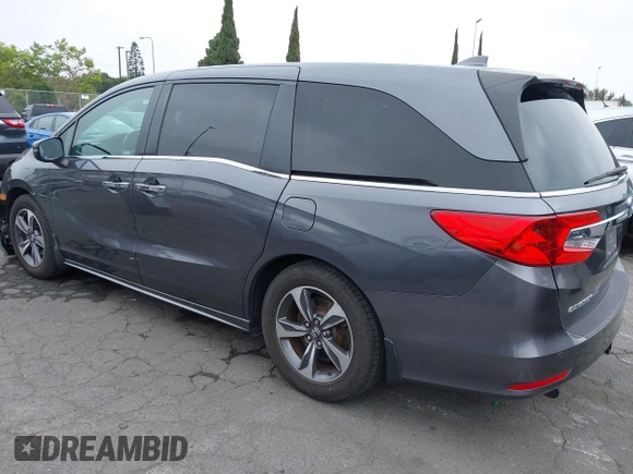 2018 Honda Odyssey Touring with VIN 5FNRL6H88JB062213, listed as a IAAI auction lot 42489379 with 90,578 mi miles and . Bid and sale history available at DreamBid. Image 3.