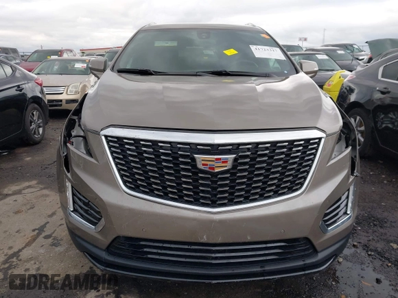 2023 Cadillac XT5 FWD Luxury z VIN 1GYKNAR45PZ140440, wystawiony jako IAAI lot #41723317 z przebiegiem 25 124 mil mil oraz . Historia ofert i sprzedaży dostępna na DreamBid. Obrazek 12.