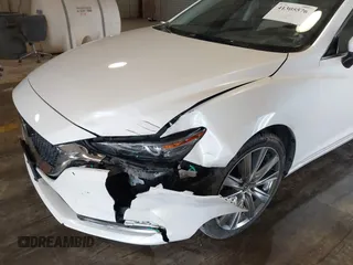 2021 Mazda 6 Carbon Edition with VIN JM1GL1WY9M1614117, listed as a IAAI auction lot 41305576 with 54,670 mi miles and . Bid and sale history available at DreamBid. Image 6.