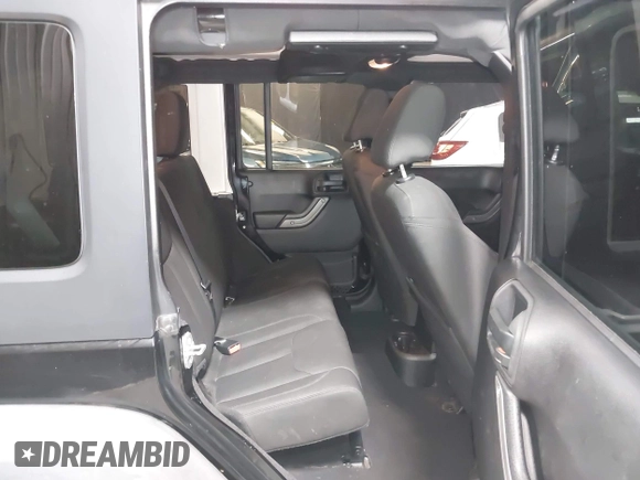 2015 Jeep Wrangler Unlimited Willys Wheeler with VIN 1C4BJWDG1FL749803, listed as a IAAI auction lot 41995132 with 156,595 mi miles and . Bid and sale history available at DreamBid. Image 8.