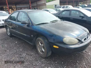 1999 Mercury Sable LS Premium Group z VIN 1MEFM53S7XA632876, wystawiony jako IAAI lot #42303137 z przebiegiem 178 617 mil mil oraz . Historia ofert i sprzedaży dostępna na DreamBid. Obrazek 6.
