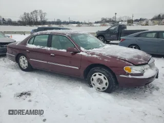 2002 Lincoln Continental with VIN 1LNHM97V62Y684873, listed as a Copart auction lot 87602665 with 52,974 mi miles and Salvage Title. Bid and sale history available at carsss.com. Image 4.