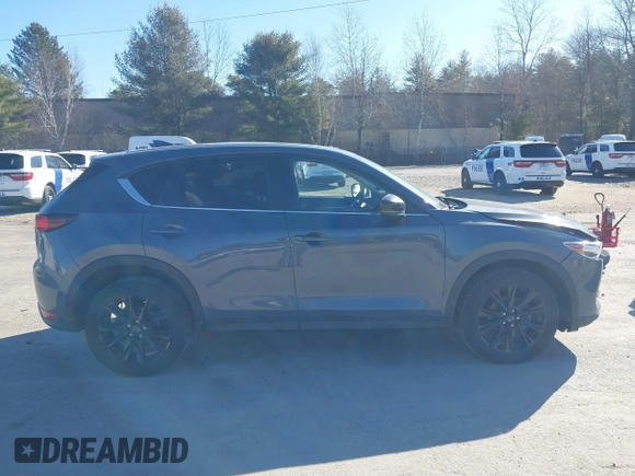 2021 Mazda CX-5 Touring with VIN JM3KFBCM0M0489644, listed as a IAAI auction lot 41756117 with 67,365 mi miles. Bid and sale history available at carsss.com. Image 13.