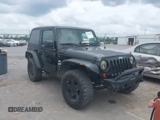 2012 Jeep Wrangler Sport with VIN 1C4AJWAG5CL105796, listed as a IAAI auction lot 42104852 with 218,724 mi miles and . Bid and sale history available at DreamBid. Image 1.