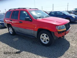 1999 Jeep Grand Cherokee Laredo with VIN 1J4GW58S5XC644757, listed as a IAAI auction lot 42139920 with 192,745 mi miles and . Bid and sale history available at DreamBid. Image 1.