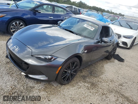 2024 Mazda MX-5 Miata Grand Touring z VIN JM1NDAM73R0603254, wystawiony jako Copart lot #74551704 z przebiegiem Nie podano mil oraz Nie do naprawy • Non repairable. Historia ofert i sprzedaży dostępna na DreamBid. Obrazek 1.