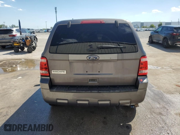 2012 Ford Escape XLS z VIN 1FMCU9C75CKB46512, wystawiony jako Copart lot #50629455 z przebiegiem Nie podano mil oraz Nie do naprawy • Non repairable. Historia ofert i sprzedaży dostępna na DreamBid. Obrazek 6.