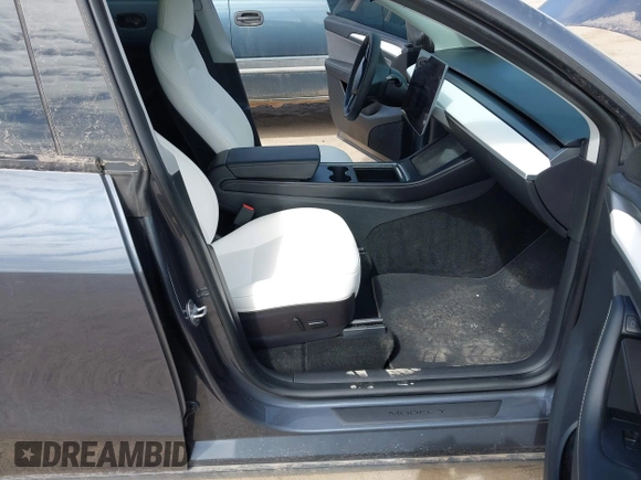 2022 Tesla Model Y Long Range with VIN 7SAYGDEE5NF534259, listed as a IAAI auction lot 41860246 with 24,513 mi miles and . Bid and sale history available at carsss.com. Image 5.