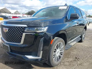 2022 Cadillac Escalade Luxury z VIN 1GYS4AKL2NR110264, wystawiony jako IAAI lot #41576203 z przebiegiem 29 457 mil mil oraz . Historia ofert i sprzedaży dostępna na DreamBid. Obrazek 2.