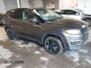 2021 Jeep Compass Latitude with VIN 3C4NJCBBXMT587271, listed as a IAAI auction lot 41446674 with 61,847 mi miles and . Bid and sale history available at carsss.com. Image 1.